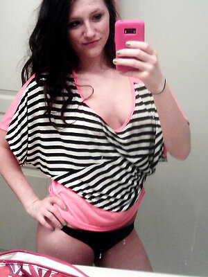 Stunning lassie takes selfies in the bathroom in rather seductive poses