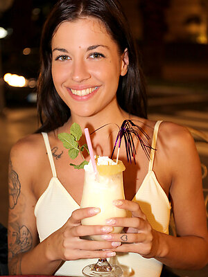 Breathtaking brunette displays her sexy tattooed body and shows her big clit