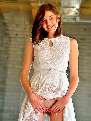 Beautiful teen babe in a pretty white dress and red heels flashes her pussy in public